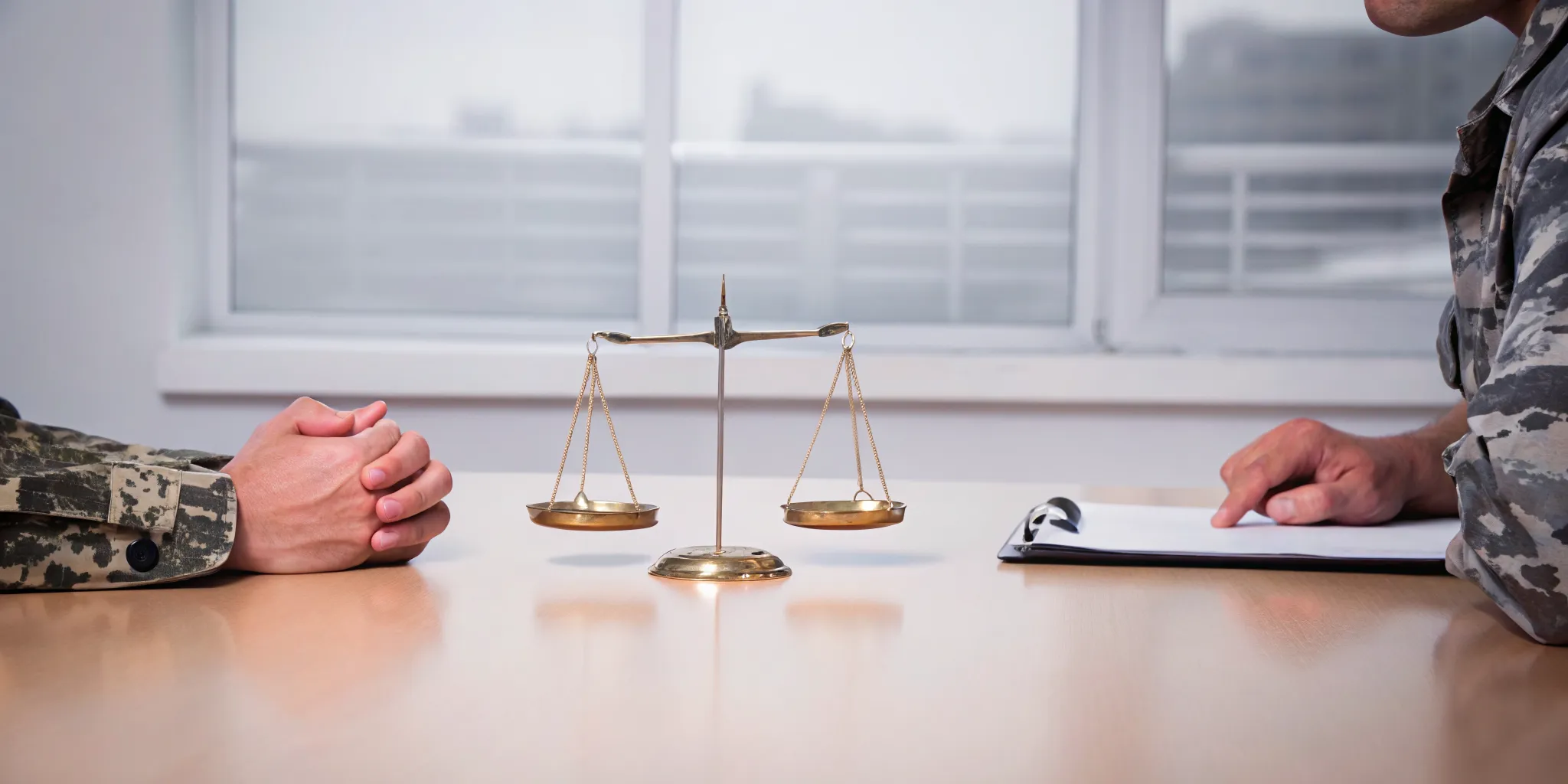 Veterans weigh the costs and benefits of hiring a VA disability coach with scales of justice.