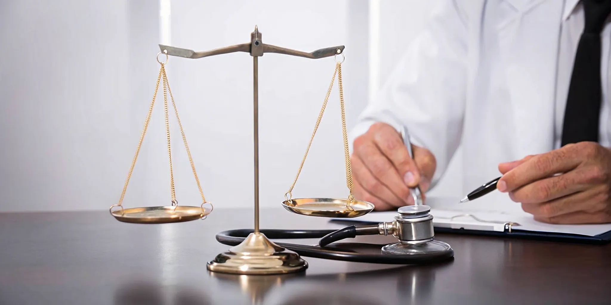 Doctor with scales of justice and a stethoscope considers the cost of an independent medical opinion for a VA claim.