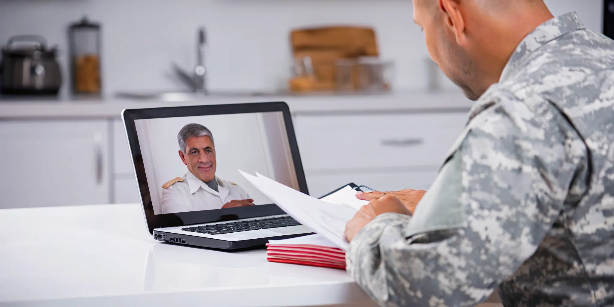 Veteran reviewing Supplemental Claim vs Higher-Level Review options after a VA denial